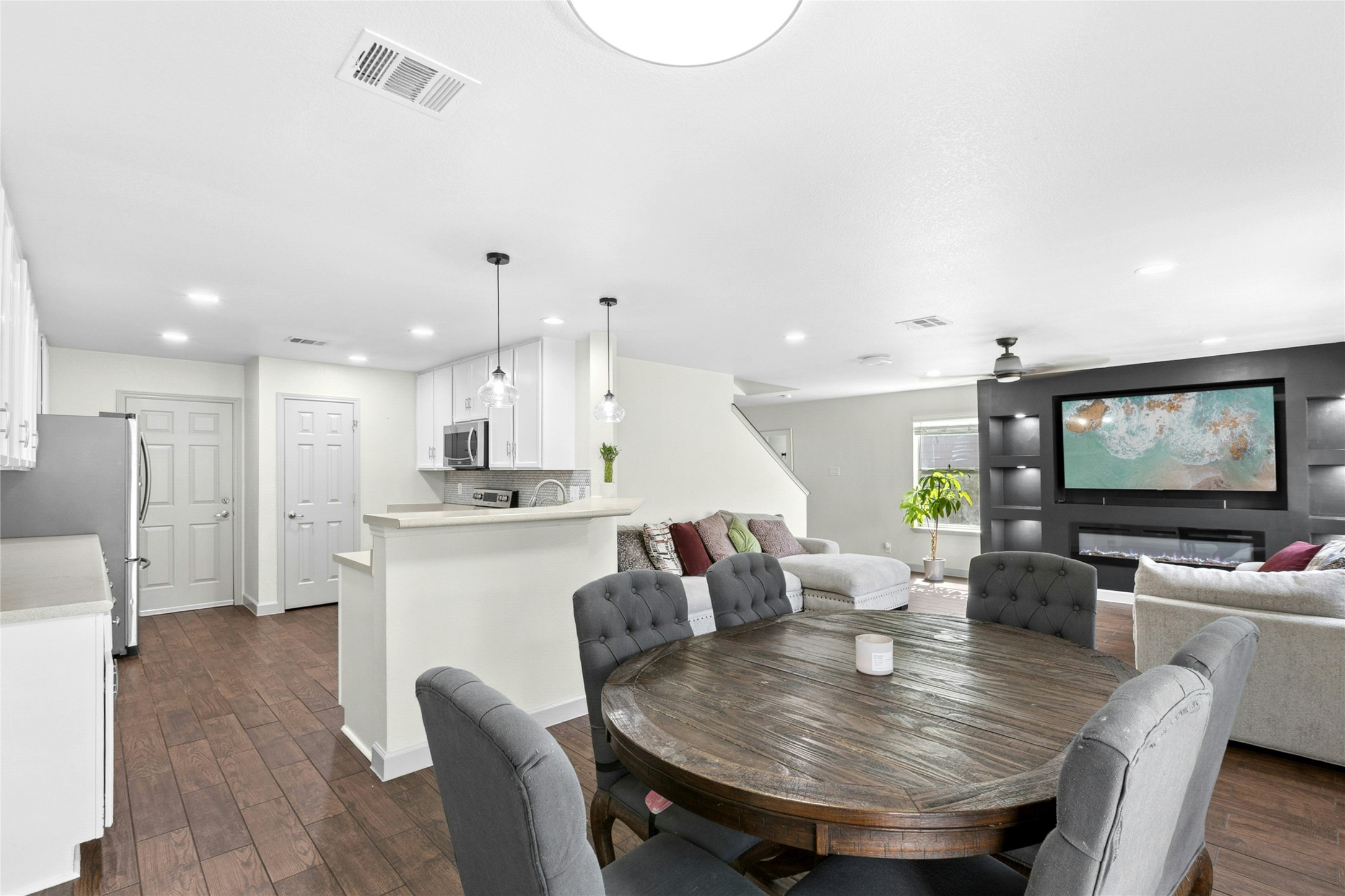 245 Myrtle Street Kyle, TX 78640 - Photo 7 of 24 Dining area featuring dark wood-style flooring, recessed lighting, and a ceiling fan