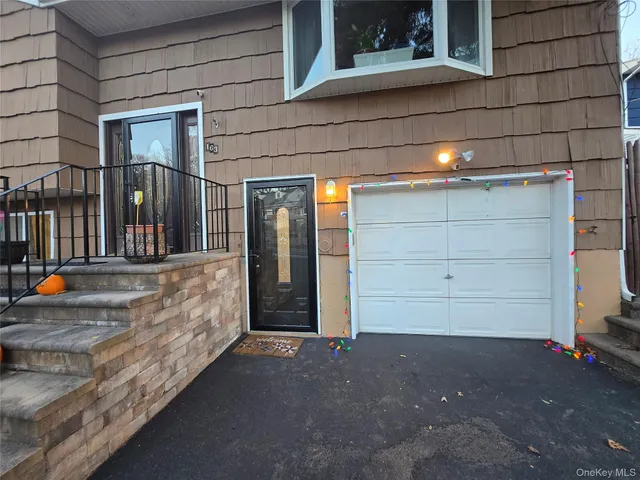 a view of a house with a street