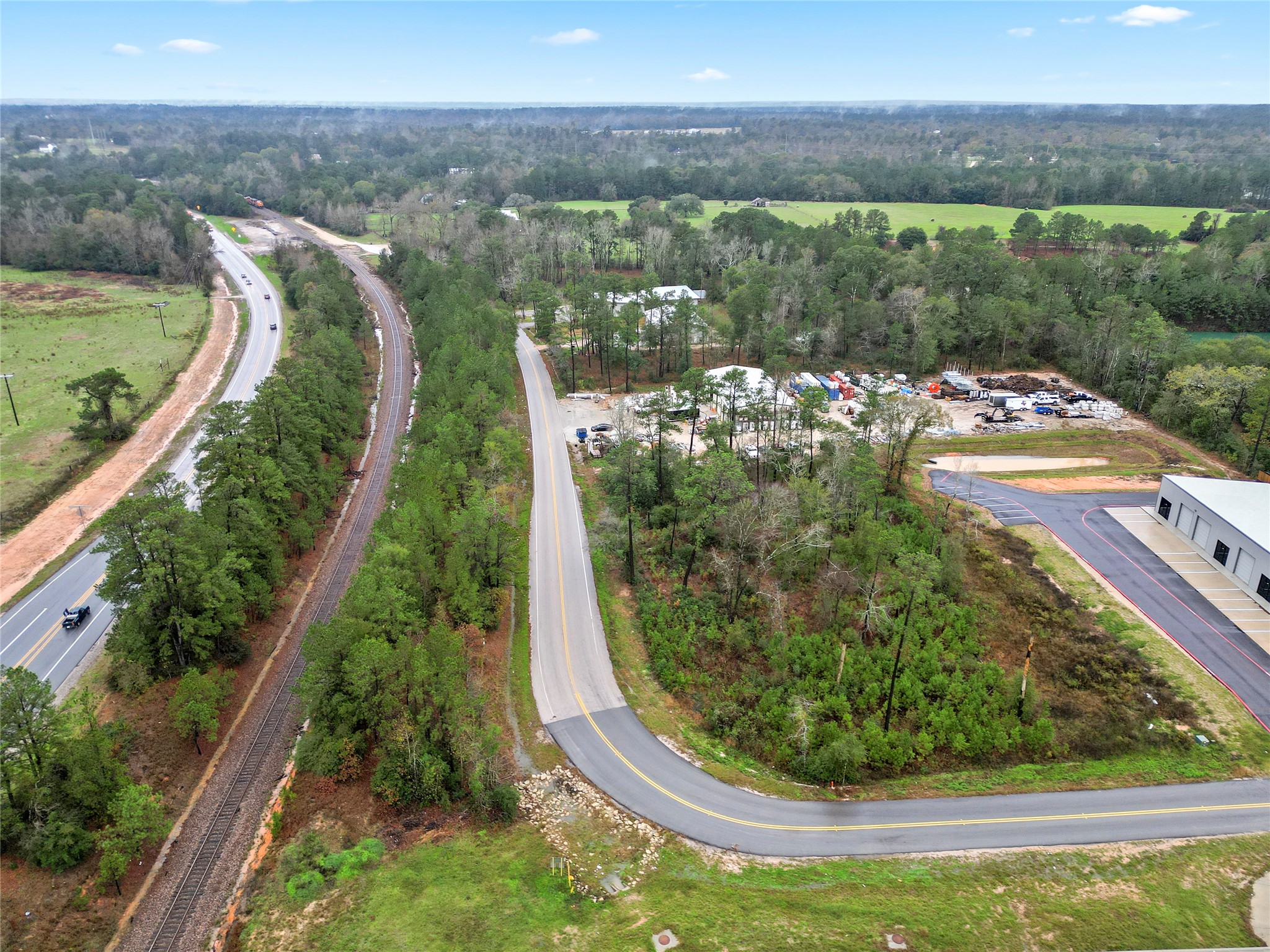 18417 Keenan Cut Off Road Montgomery, TX 77316 - Photo 4 of 15 a view of a lake with a yard from a balcony