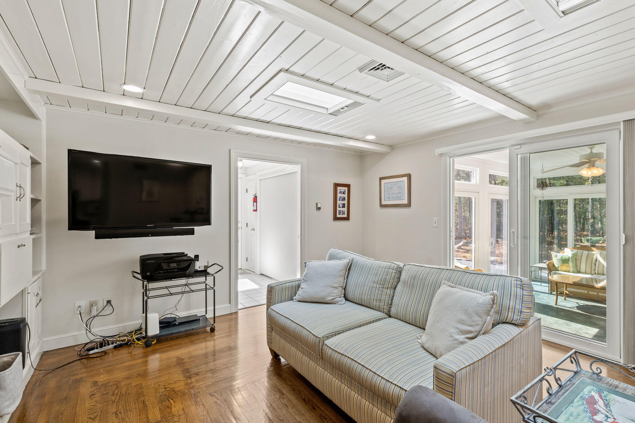 29 Amanda Court Cotuit, MA 02635 - Photo 13 of 45 a living room with furniture and a flat screen tv