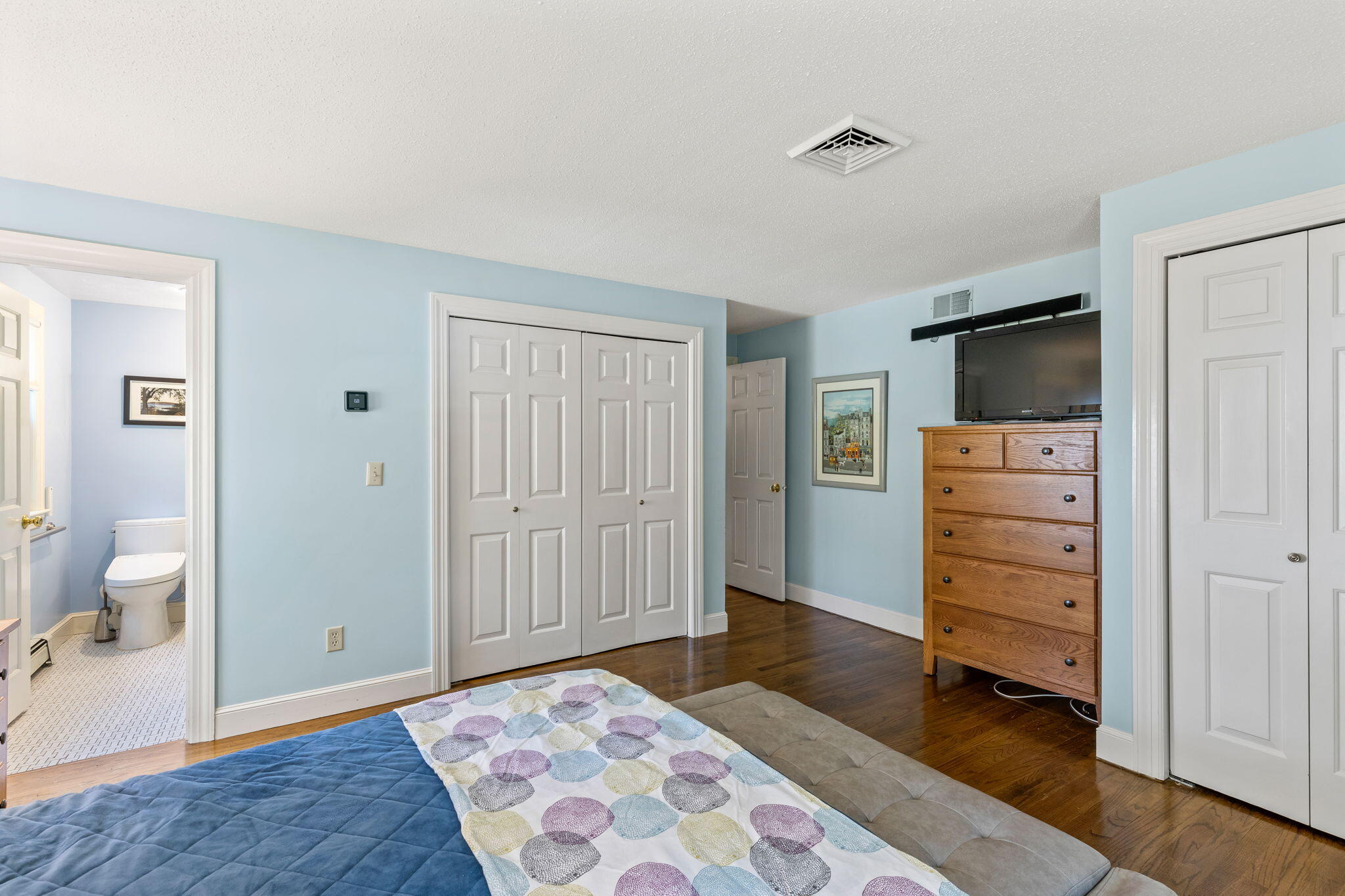 29 Amanda Court Cotuit, MA 02635 - Photo 17 of 45 a bedroom with a bed and wooden floor