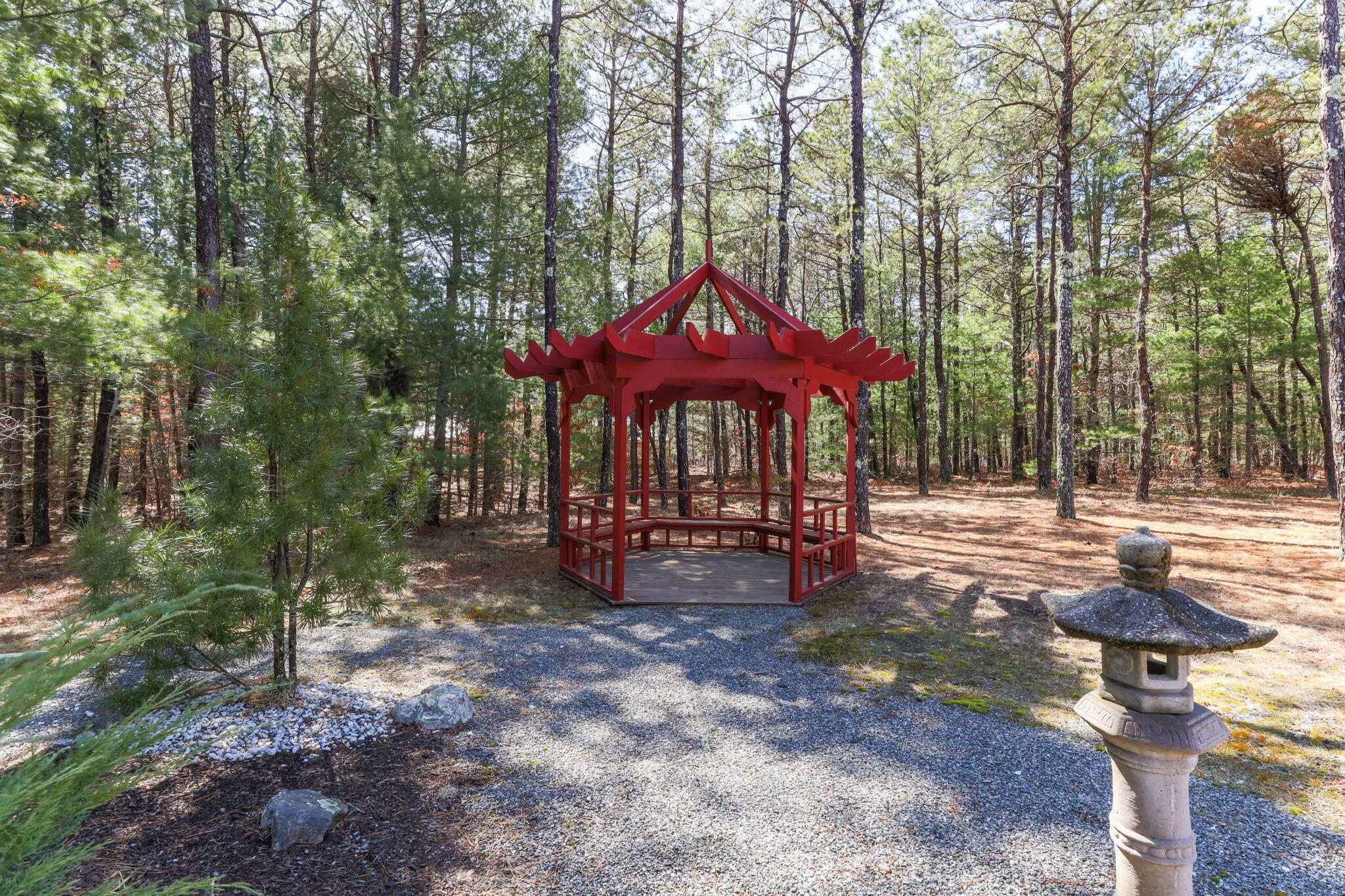 29 Amanda Court Cotuit, MA 02635 - Photo 34 of 45 a view of a patio with table and chairs under an umbrella