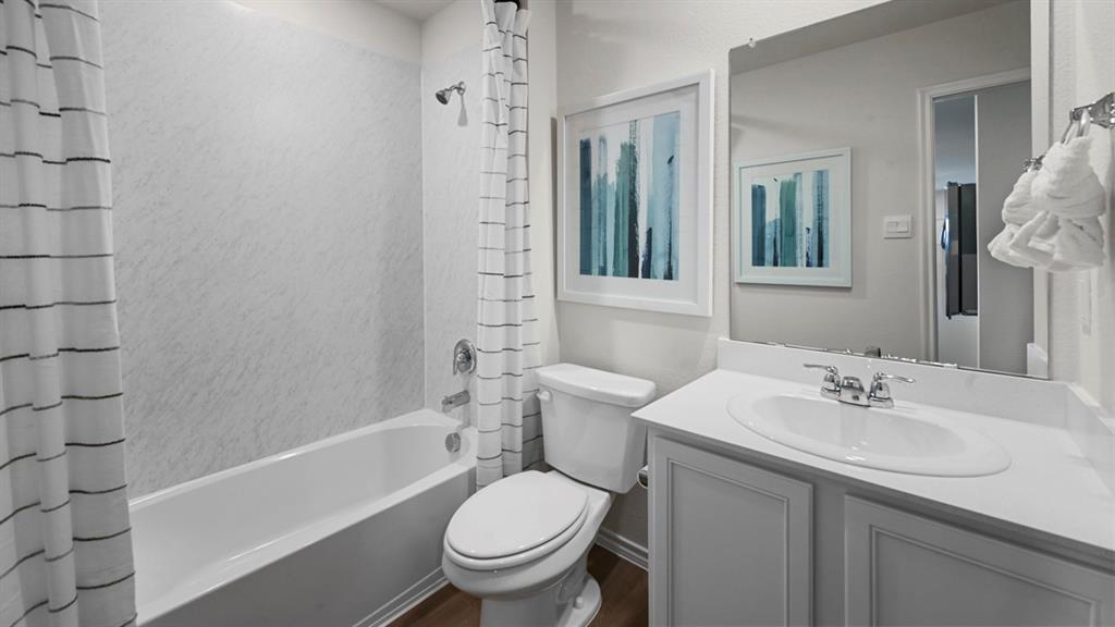 936 Jefferson Way Sherman, TX 75092 - Photo 2 of 31 a bathroom with a sink toilet and shower