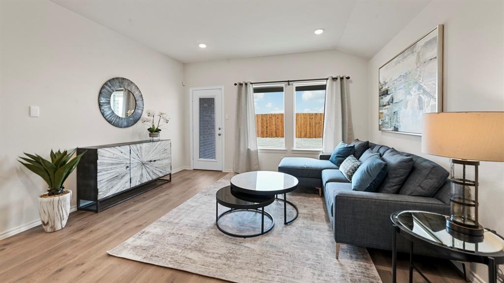 936 Jefferson Way Sherman, TX 75092 - Photo 20 of 31 a living room with furniture a couch and a potted plant