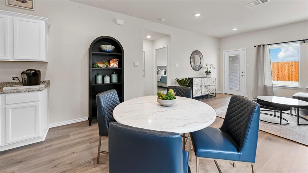 936 Jefferson Way Sherman, TX 75092 - Photo 25 of 31 a view of a dining room with furniture window and wooden floor