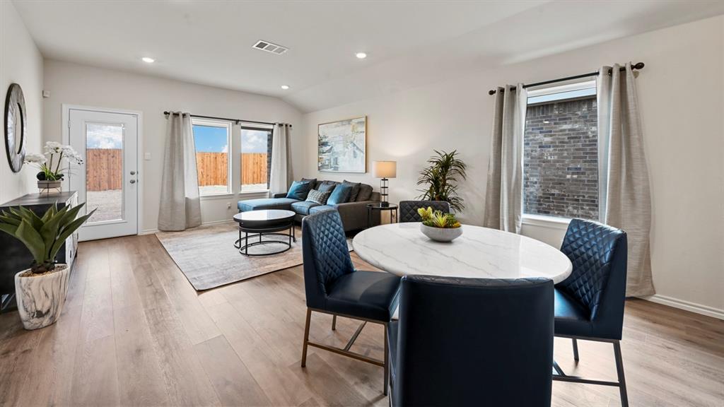 936 Jefferson Way Sherman, TX 75092 - Photo 27 of 31 a view of a a dining room with furniture window and wooden floor
