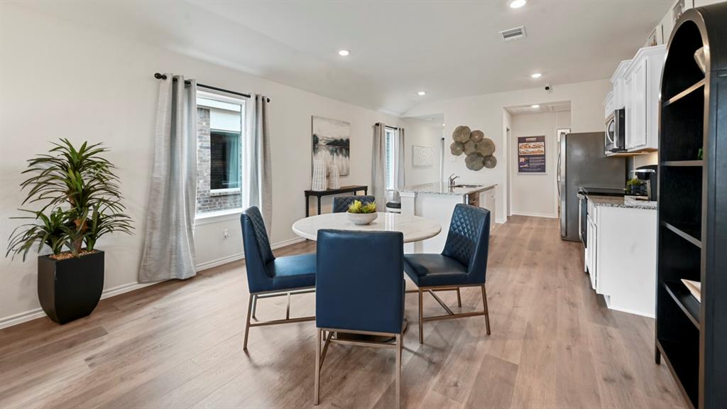 936 Jefferson Way Sherman, TX 75092 - Photo 28 of 31 a dining room with furniture a kitchen and chandelier