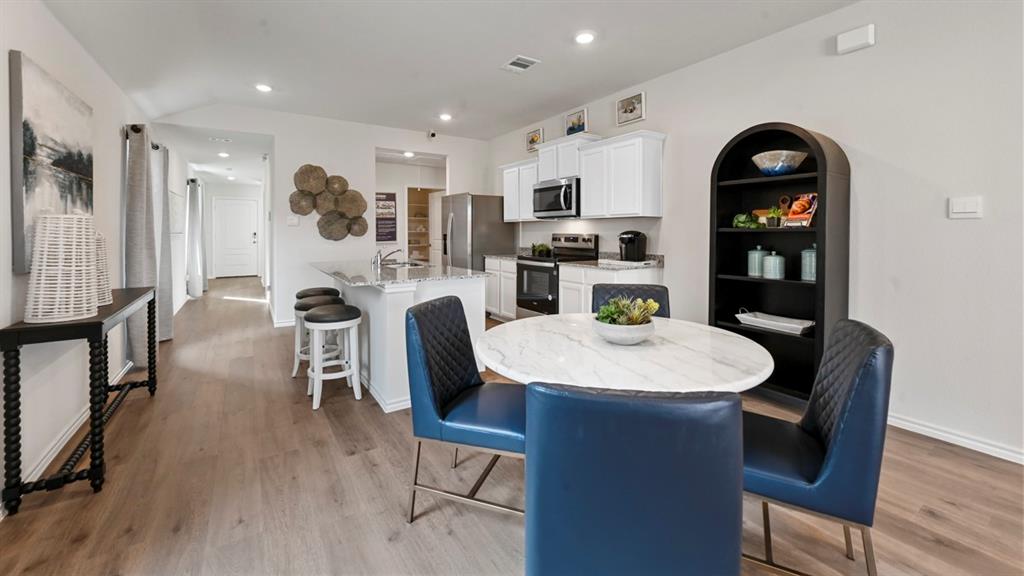 936 Jefferson Way Sherman, TX 75092 - Photo 29 of 31 a view of a dining room with furniture and wooden floor