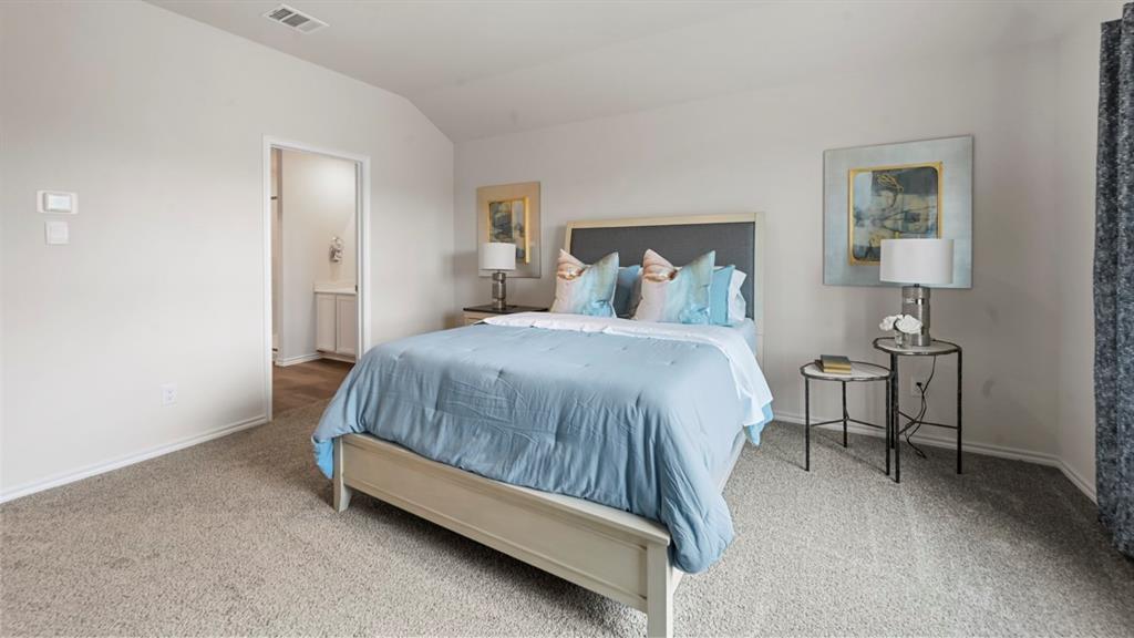 936 Jefferson Way Sherman, TX 75092 - Photo 8 of 31 a bedroom with a bed and lamp