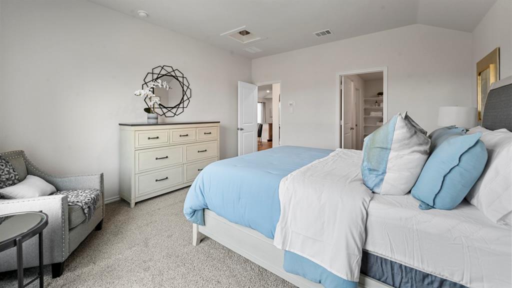 936 Jefferson Way Sherman, TX 75092 - Photo 9 of 31 a bedroom with a bed and a dresser