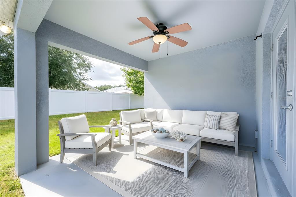 1355 Windward Oaks Loop Auburndale, FL 33823 - Photo 14 of 25 a living room with furniture and a large window