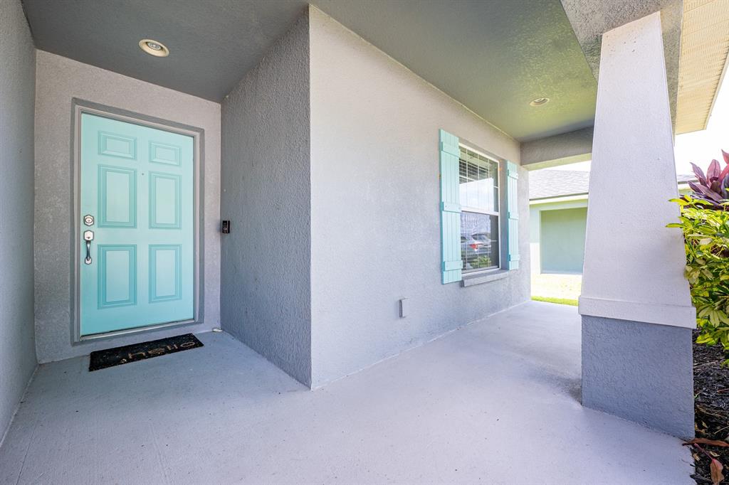 1355 Windward Oaks Loop Auburndale, FL 33823 - Photo 17 of 25 an empty room with windows and entrance