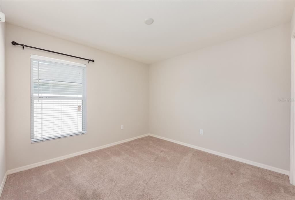 1355 Windward Oaks Loop Auburndale, FL 33823 - Photo 24 of 25 an empty room with a window