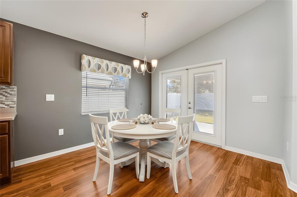 1355 Windward Oaks Loop Auburndale, FL 33823 - Photo 6 of 25 a dining room with furniture and window