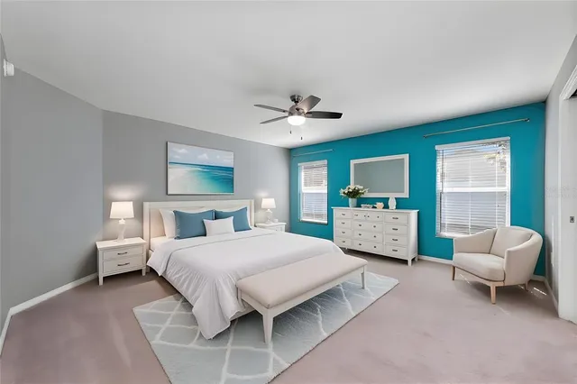 a bedroom with a bed couch and a window