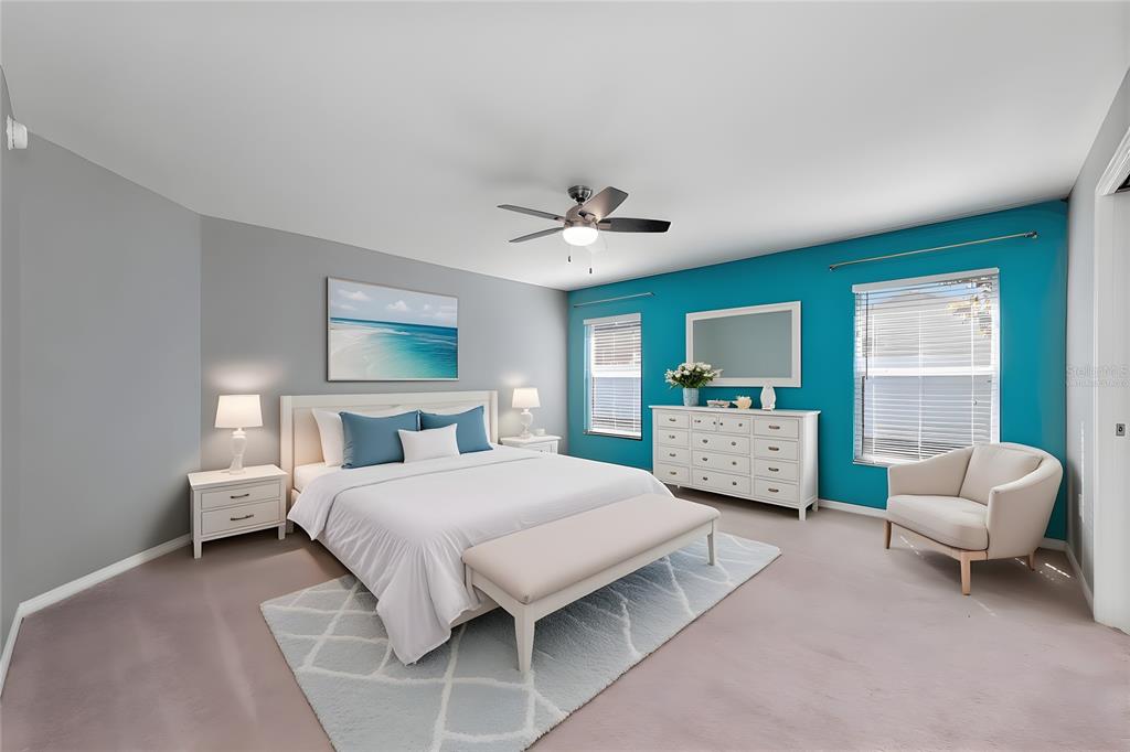 1355 Windward Oaks Loop Auburndale, FL 33823 - Photo 7 of 25 a bedroom with a bed couch and a window