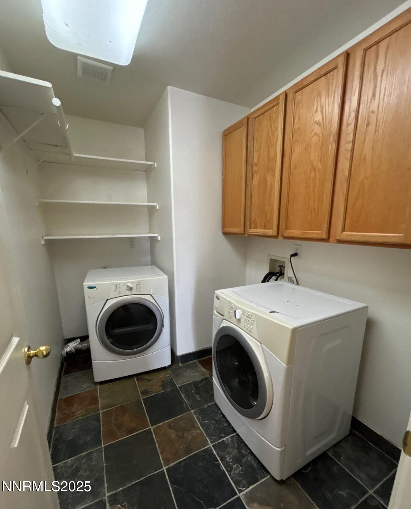 7470 Rodin Court Sun Valley, NV 89433 - Photo 16 of 23 a utility room with dryer and washer