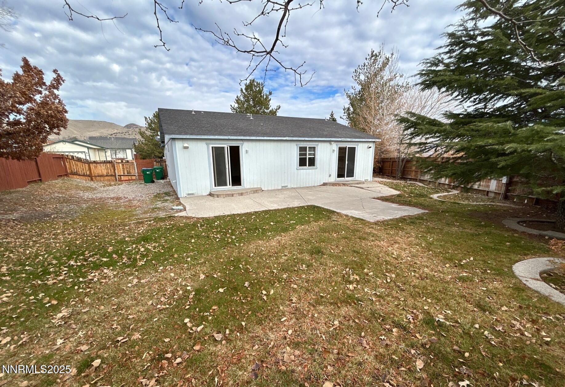 7470 Rodin Court Sun Valley, NV 89433 - Photo 20 of 23 a view of a house with a yard
