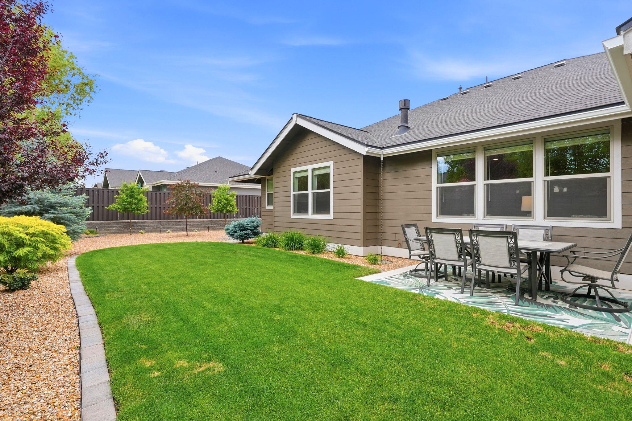 2714 Northwest 23rd Street Redmond, OR 97756 - Photo 43 of 57 a front view of house with a garden and patio