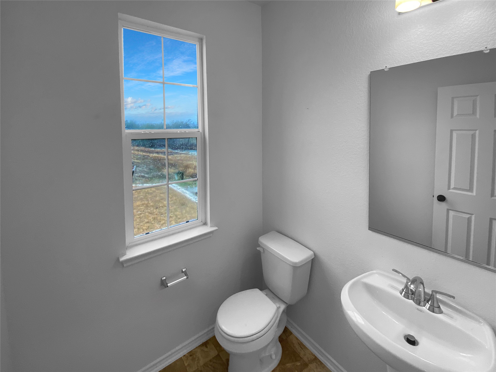 932 Yellow Ribbon Trail Jarrell, TX 76537 - Photo 18 of 26 a bathroom with a toilet sink and mirror