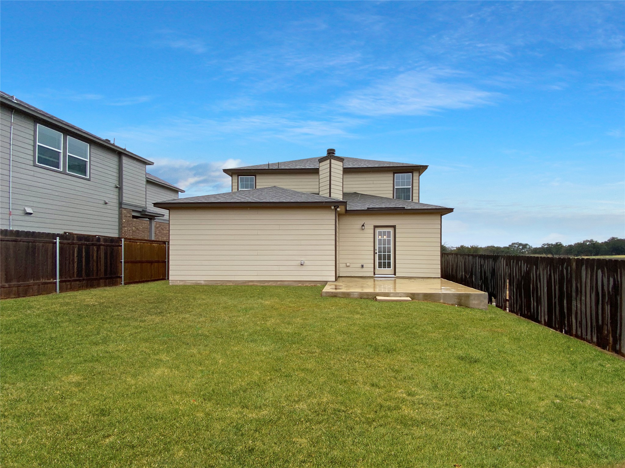 932 Yellow Ribbon Trail Jarrell, TX 76537 - Photo 21 of 26 a front view of a house with a yard and garage