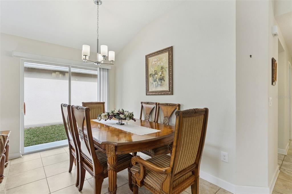 3342 Raleigh Drive Winter Haven, FL 33884 - Photo 13 of 50 a view of a dining room with furniture window and outside view