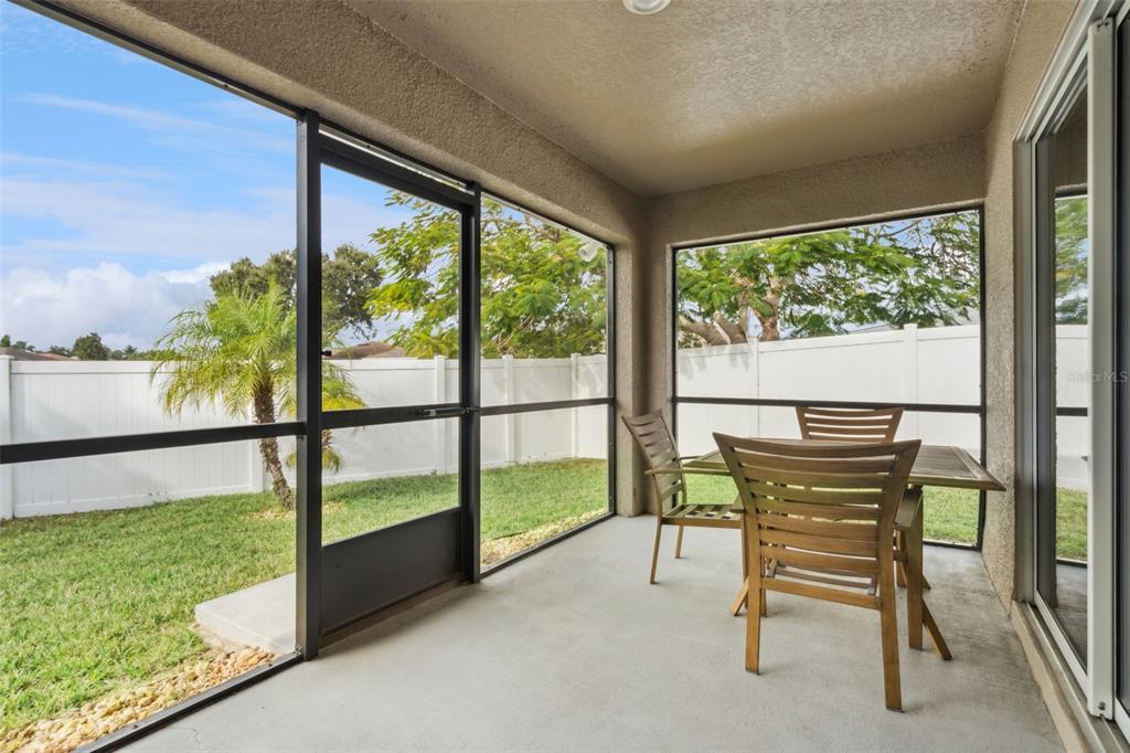 3342 Raleigh Drive Winter Haven, FL 33884 - Photo 24 of 50 a view of a porch with chairs and backyard