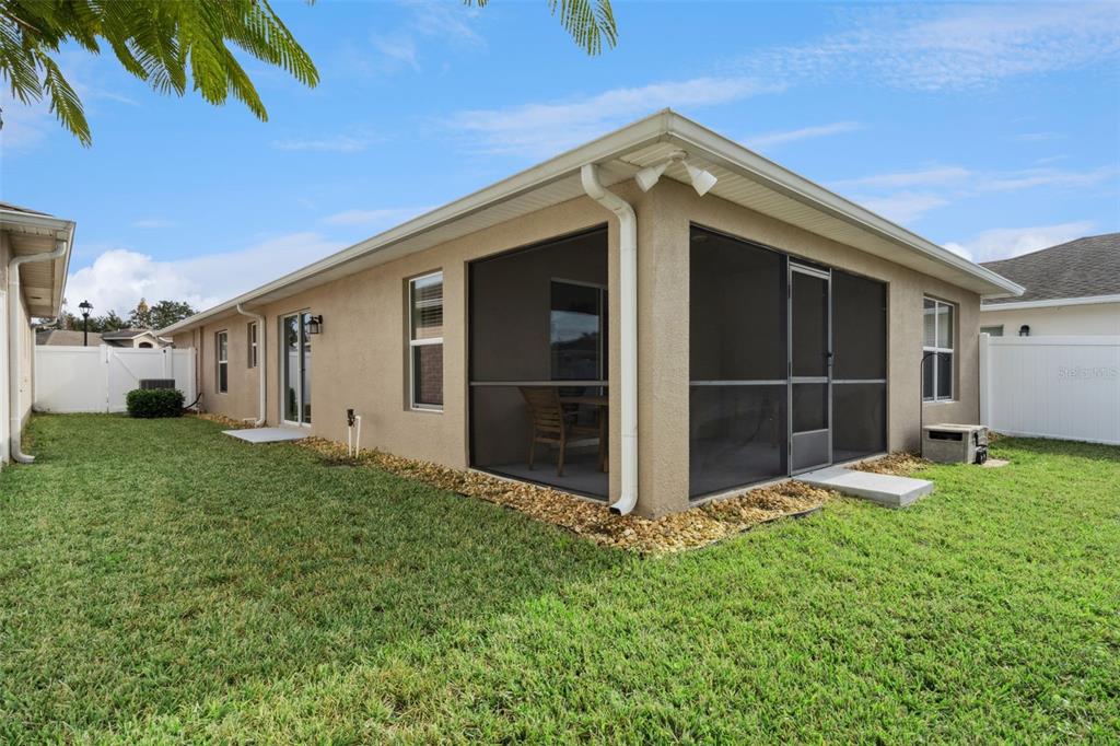3342 Raleigh Drive Winter Haven, FL 33884 - Photo 28 of 50 a front view of a house with a yard