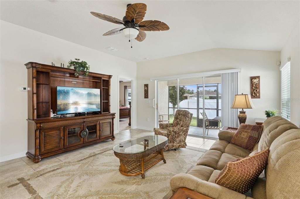 3342 Raleigh Drive Winter Haven, FL 33884 - Photo 4 of 50 a living room with furniture and a flat screen tv