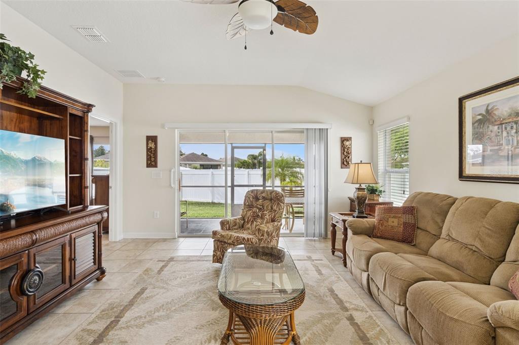 3342 Raleigh Drive Winter Haven, FL 33884 - Photo 5 of 50 a living room with furniture and a flat screen tv