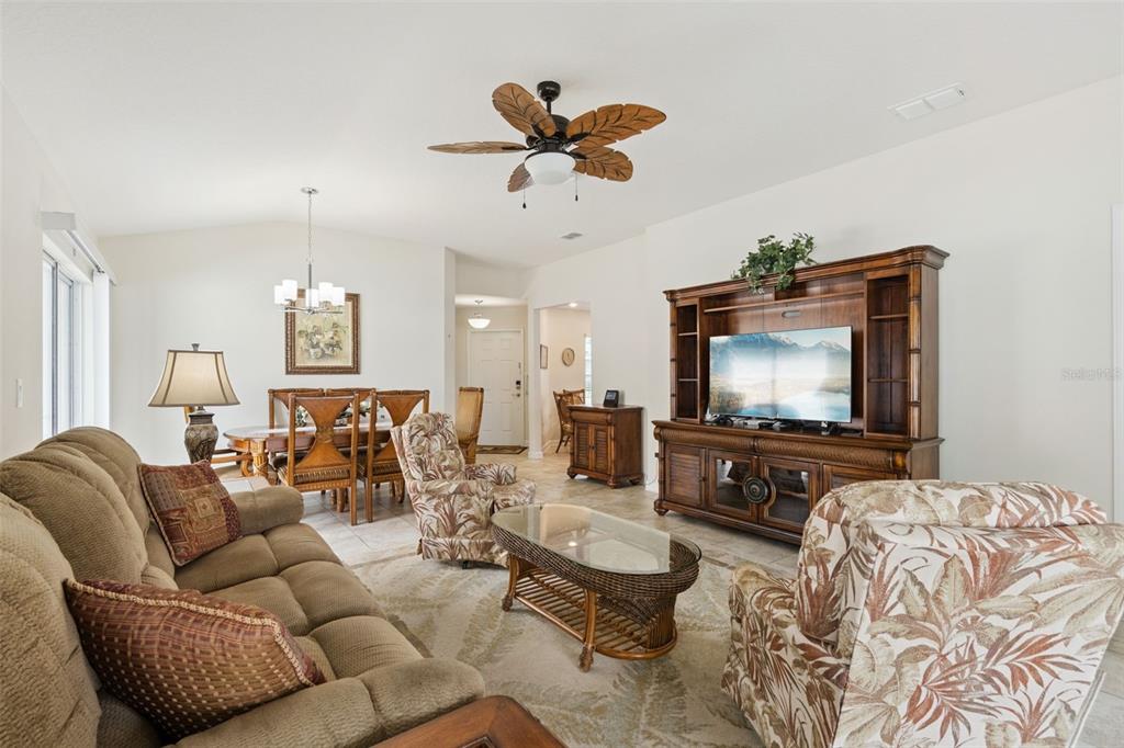 3342 Raleigh Drive Winter Haven, FL 33884 - Photo 7 of 50 a living room with furniture and a flat screen tv