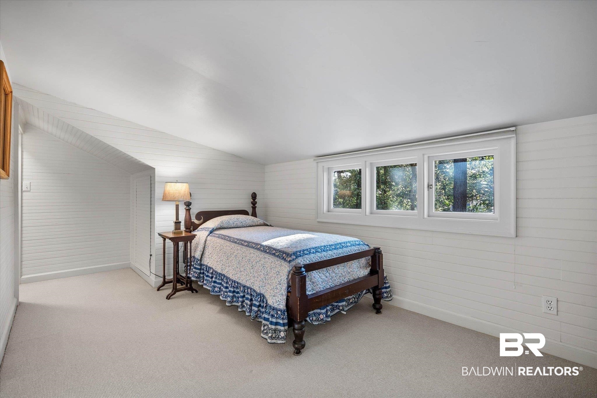 2 Westgate Road Mobile, AL 36608 - Photo 36 of 63 Bedroom featuring wooden walls, lofted ceiling, and light colored carpet