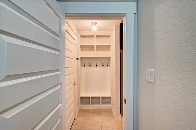 a kitchen with a counter space and wooden floor