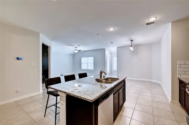 a view of livingroom with hardwood floor and kitchen view