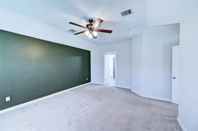 a spacious bathroom with double vanity and mirrors