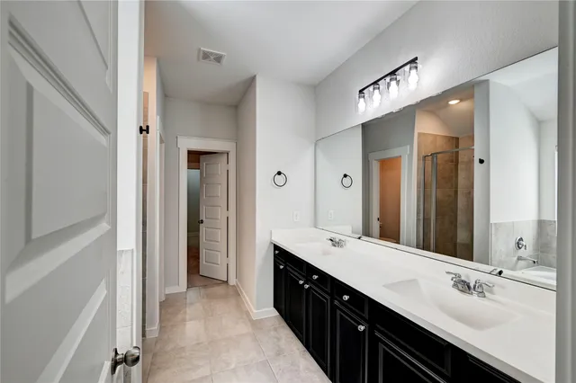 a view of a bathroom from the hallway