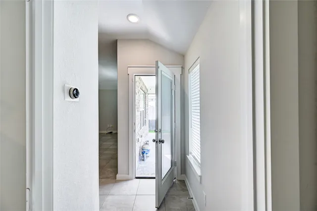 a view of a back yard with a wooden fence