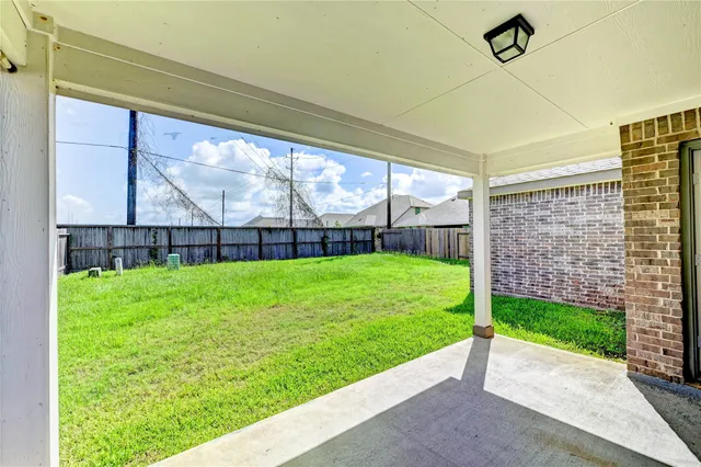 a view of a house with yard and front view of a house