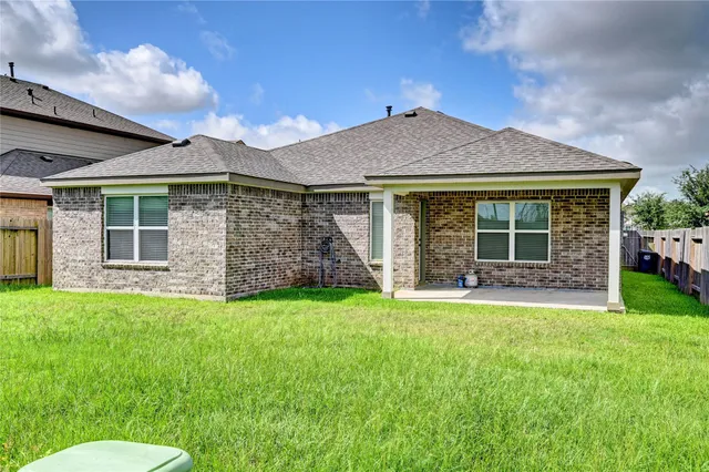 a large kitchen with stainless steel appliances granite countertop a sink and cabinets