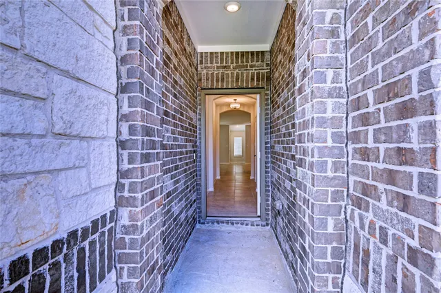 a view of entryway with a brick wall