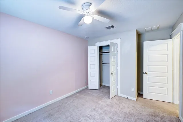 a view of a big yard with palm trees