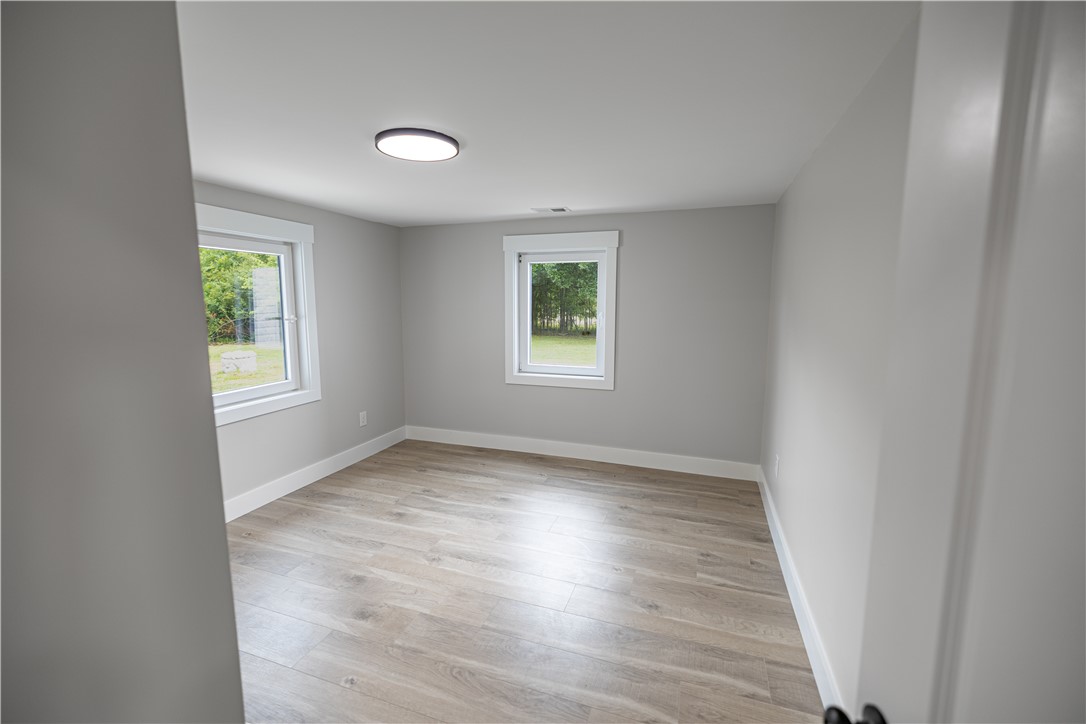 2817 Broadway Lake Road Anderson, SC 29621 - Photo 18 of 41 A well-lit, adaptable space with resilient flooring and two windows overlooking verdant greenery.