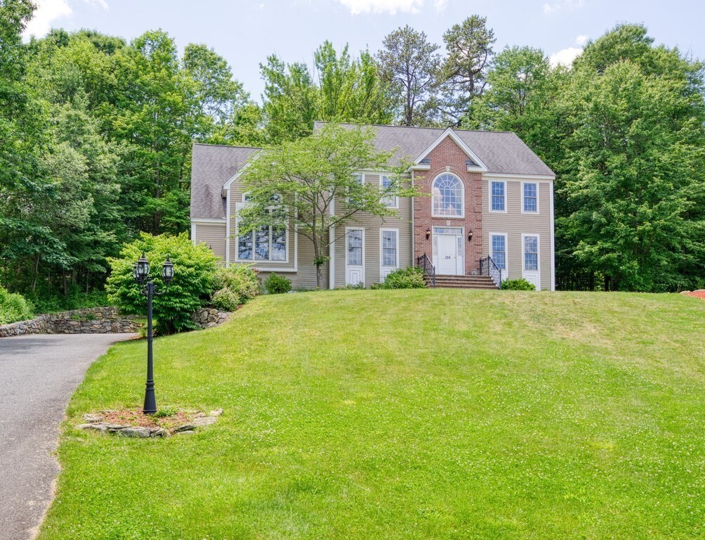 126 Walnut Street Shrewsbury, MA 01545 - Photo 1 of 41 a front view of house with yard and green space