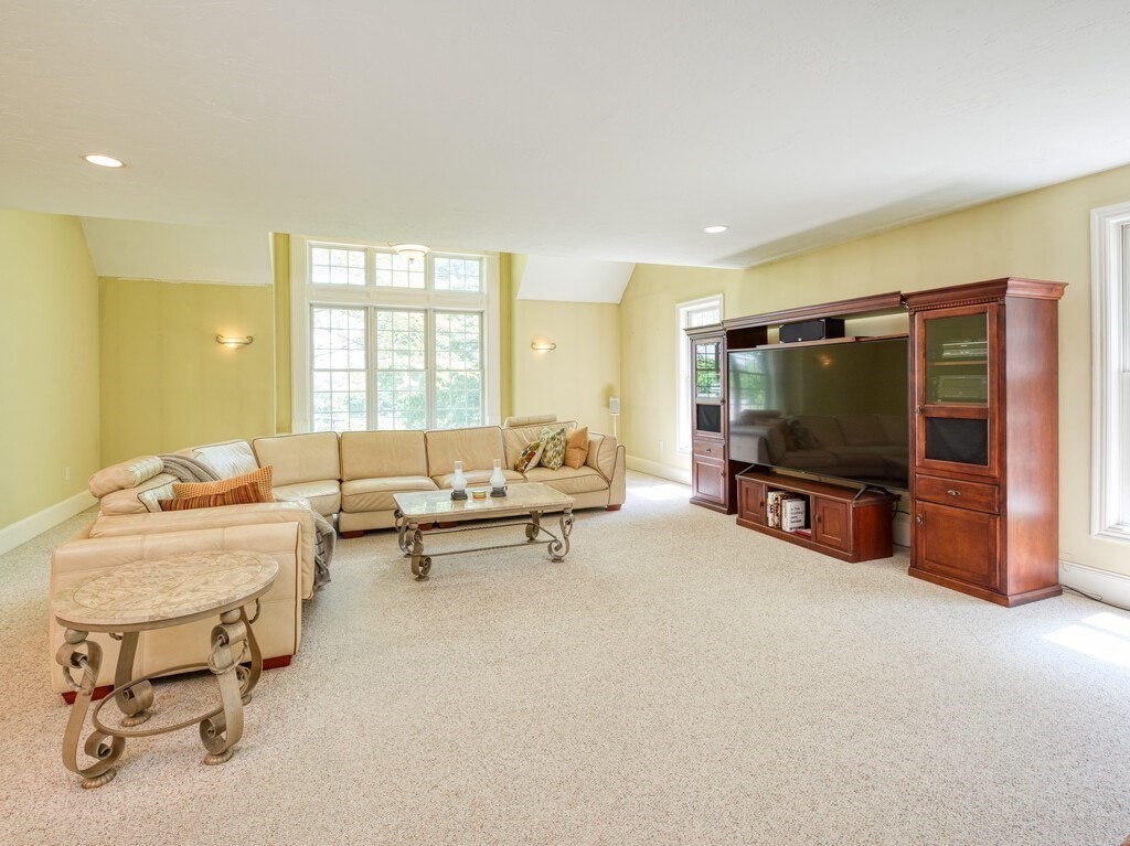 126 Walnut Street Shrewsbury, MA 01545 - Photo 16 of 41 a living room with furniture and a flat screen tv