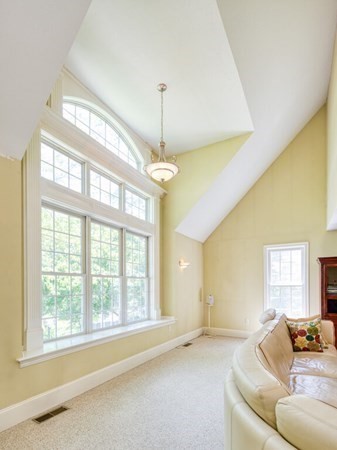 126 Walnut Street Shrewsbury, MA 01545 - Photo 18 of 41 a living room with furniture and a chandelier