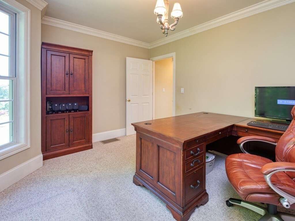 126 Walnut Street Shrewsbury, MA 01545 - Photo 22 of 41 a living room with a stove and a refrigerator