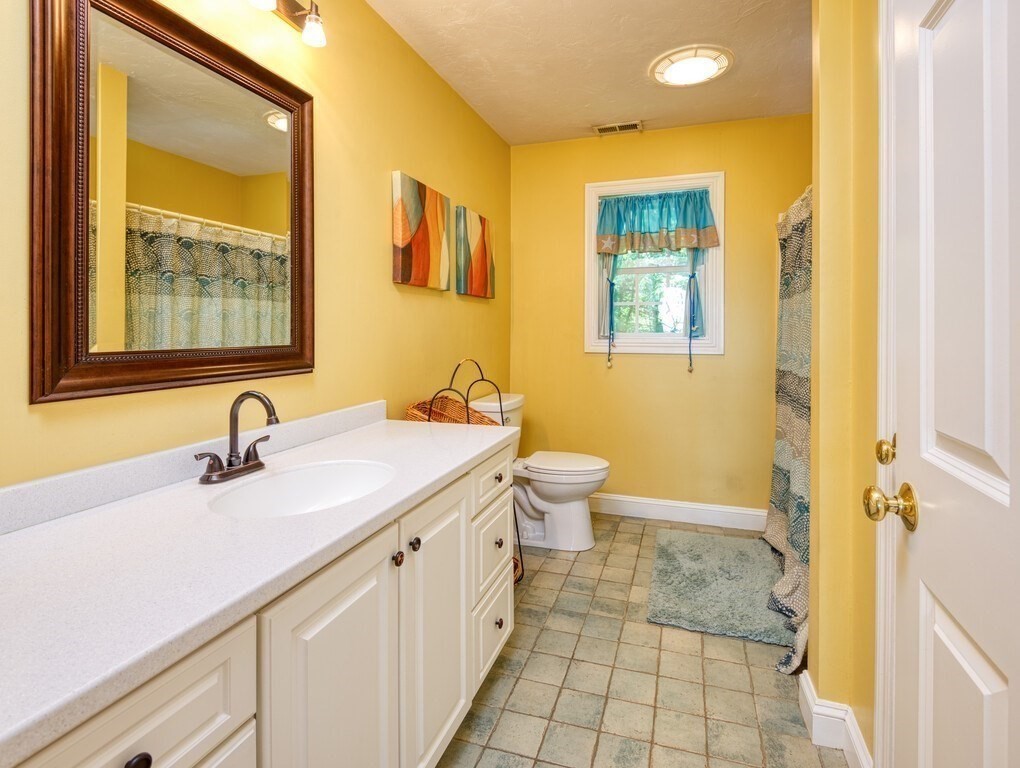 126 Walnut Street Shrewsbury, MA 01545 - Photo 31 of 41 a bathroom with a sink and a mirror