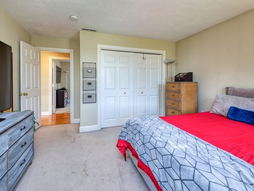 126 Walnut Street Shrewsbury, MA 01545 - Photo 33 of 41 a bedroom with a bed and a dresser