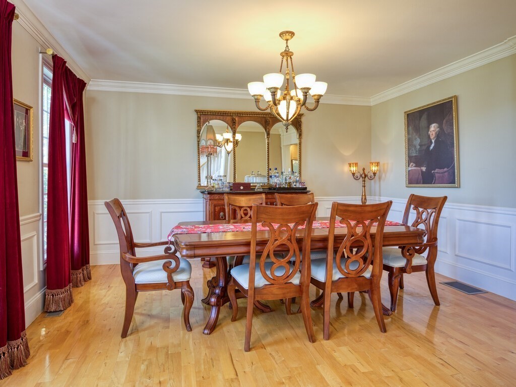 126 Walnut Street Shrewsbury, MA 01545 - Photo 6 of 41 a view of a dining room with furniture wooden floor and chandelier