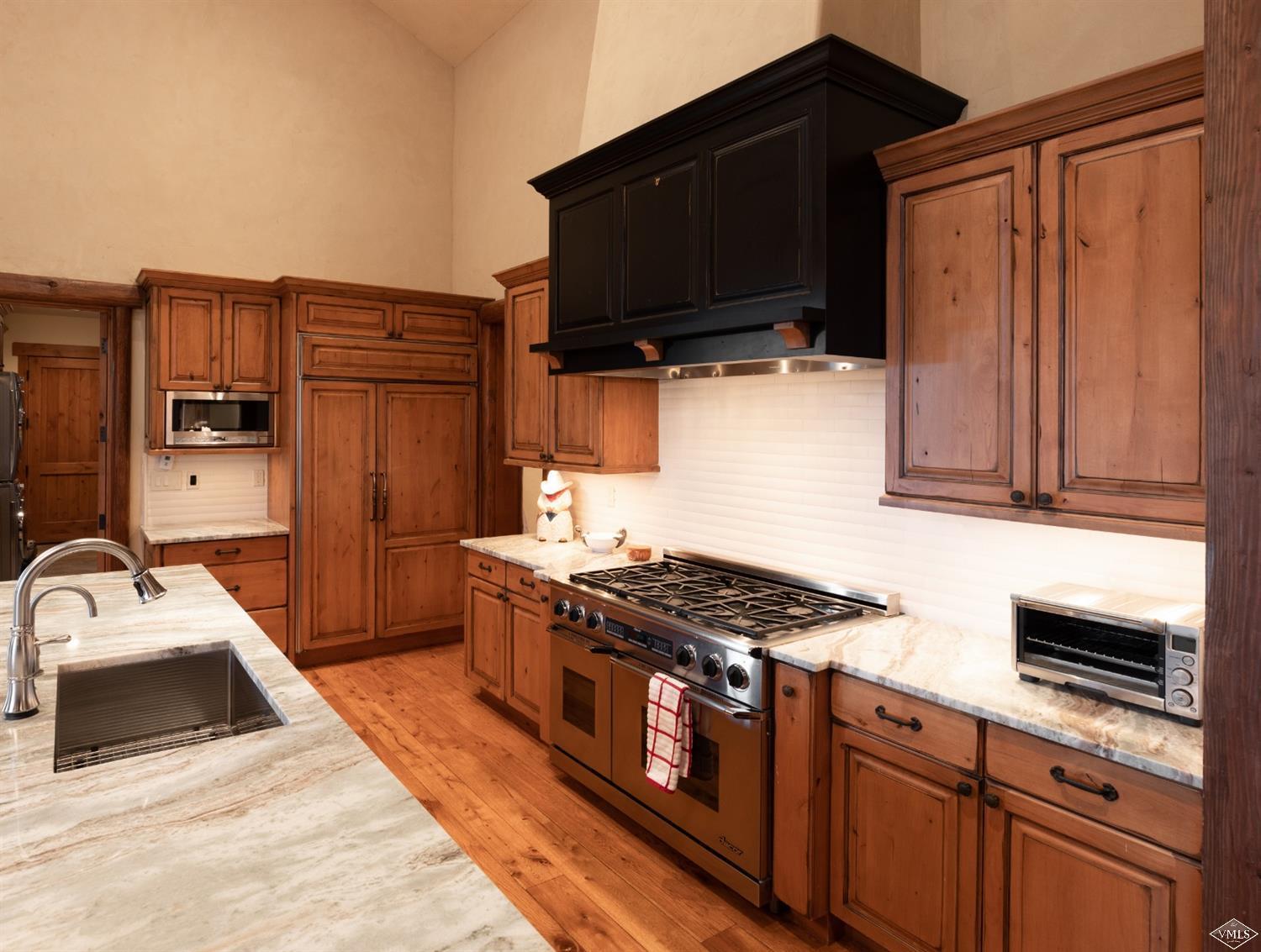 303 Graham Road Edwards, CO 81632 - Photo 3 of 13 a kitchen with stainless steel appliances granite countertop a sink stove and microwave